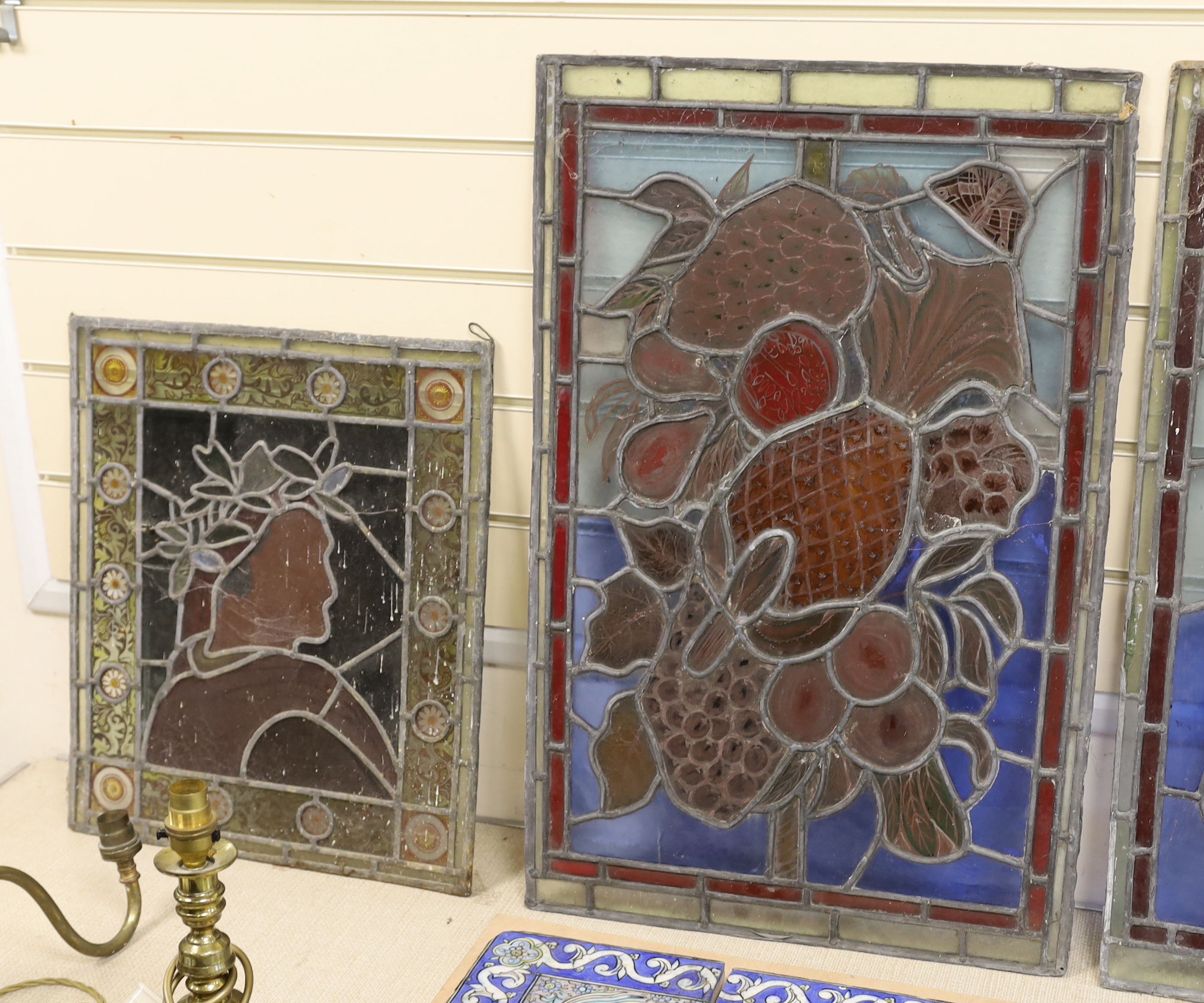 Four Victorian stained glass panels, tallest 70cm high x 39cm wide